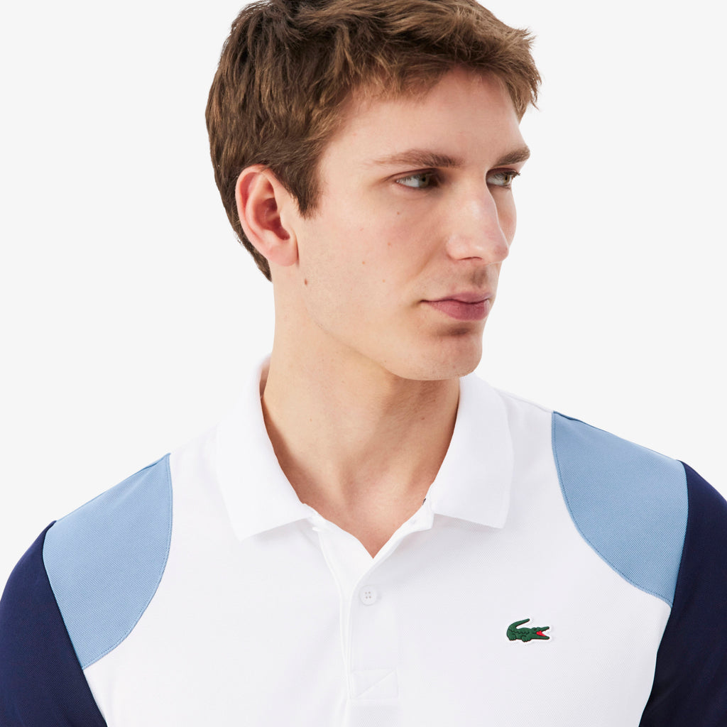 Polo deportivo con bloques de color Ultra Dry